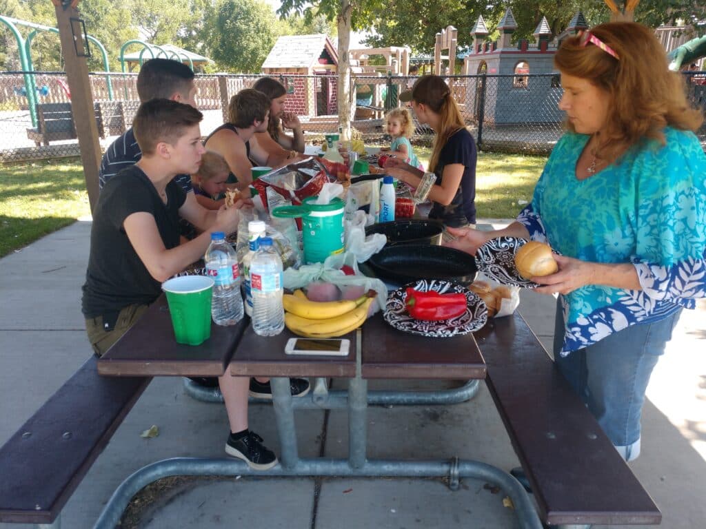 family picnicing outside